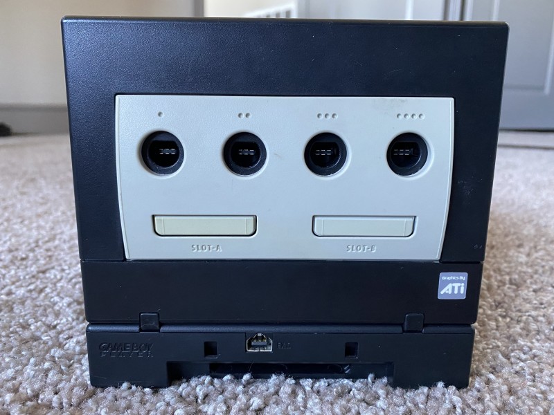 An image of the front of the GameCube console, with Game Boy Player below
